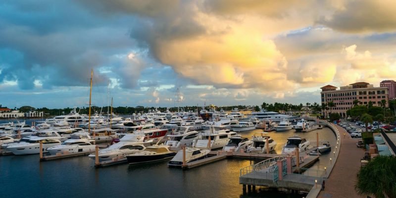 Many seniors' boats are docked in a marina at sunset in Palm Harbor.