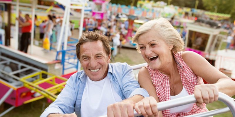 An older couple enjoying a ride on a ferris wheel at one of Palm Harbor's local festivals.
