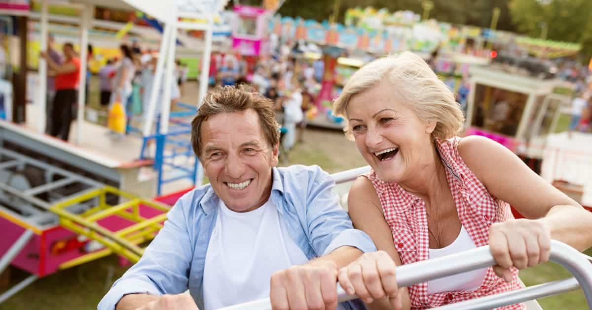 An older couple enjoying a ride on a ferris wheel at one of Palm Harbor's local festivals.