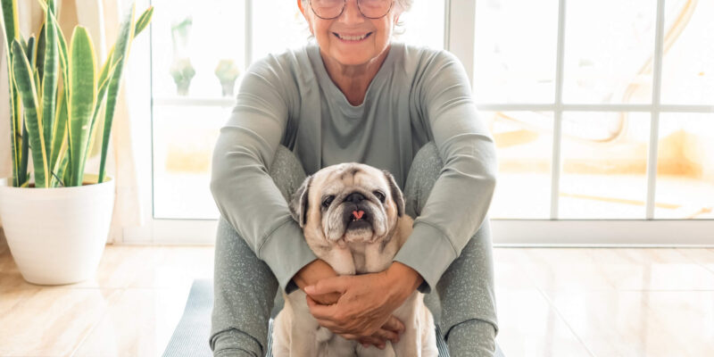 Wellness benefits of pet friendly senior living communities Older woman with dog