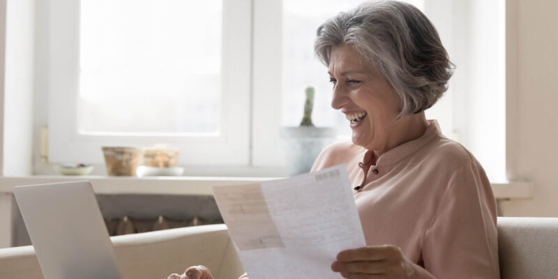 Senior living tax advantage medical expense deduction Elder woman reviewing tax information