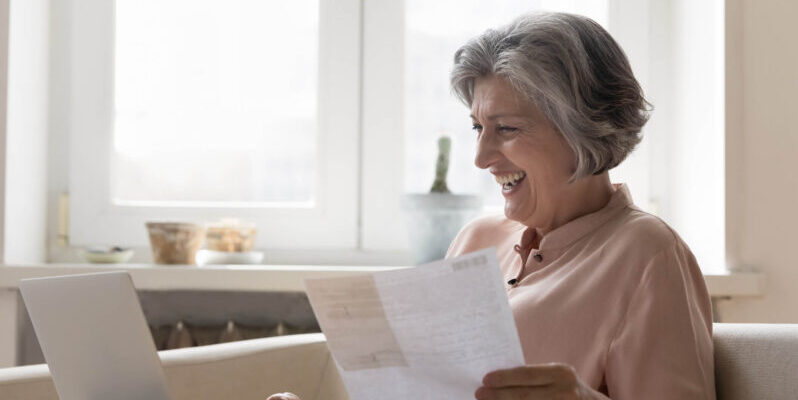 Senior living tax advantage medical expense deduction Elder woman reviewing tax information
