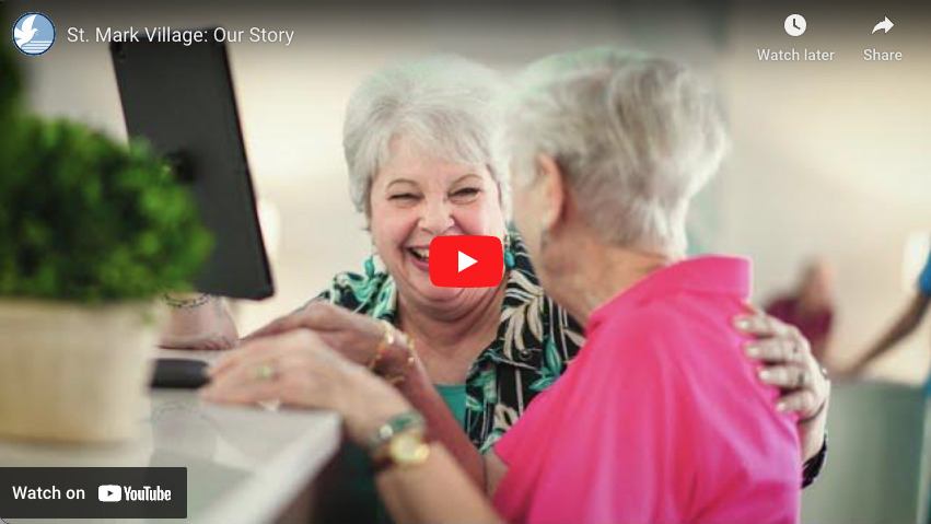 A video showing two elderly women hugging each other.