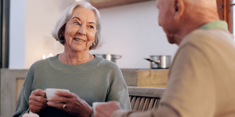 Elder couple discussing the pros and cons of senior living.