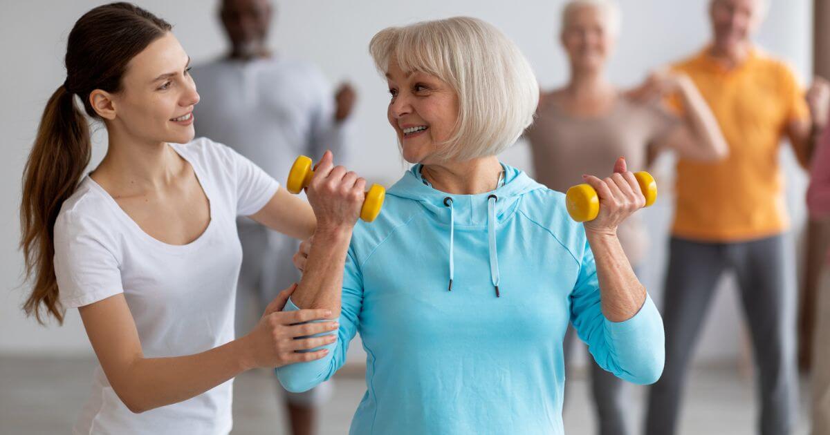 Senior group of solo agers in an exercising class.