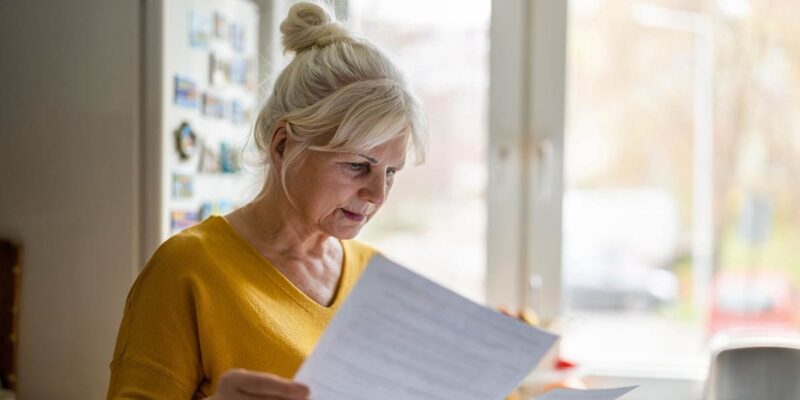 Senior looking at the paperwork