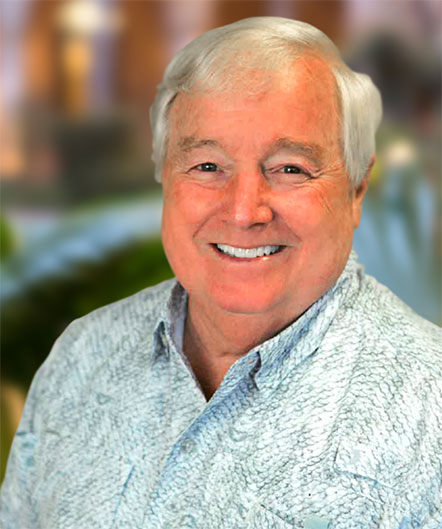 An older man with white hair smiles at the camera, wearing a light patterned shirt. The softly blurred green and brown background reflects the welcoming atmosphere of St. Mark Village, a community devoted to exceptional senior living. An older man with white hair smiles at the camera, wearing a light patterned shirt. The softly blurred green and brown background reflects the welcoming atmosphere of St. Mark Village, a community devoted to exceptional senior living.