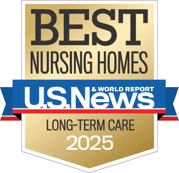 A gold badge reads "Best Nursing Homes U.S. News & World Report Long-Term Care 2025," showcasing St. Mark Village’s commitment to exceptional senior living.