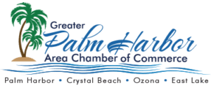Logo for Greater Palm Harbor Area Chamber of Commerce featuring a palm tree and ocean waves, listing Palm Harbor, Crystal Beach, Ozona, East Lake, and St. Mark Village—highlighting community and senior living.