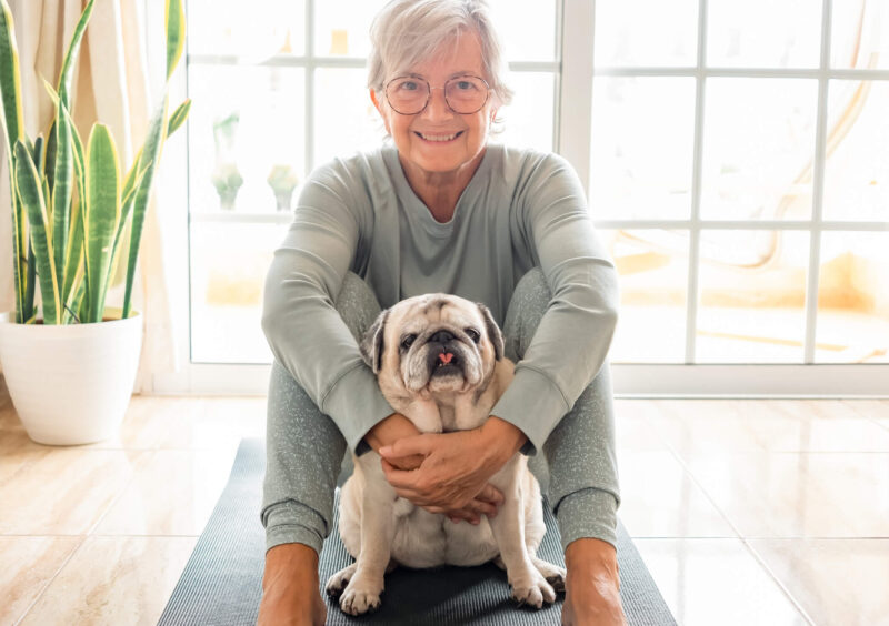 Wellness benefits of pet friendly senior living communities Older woman with dog