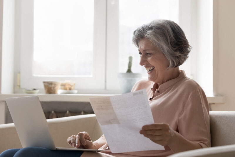 Senior living tax advantage medical expense deduction Elder woman reviewing tax information