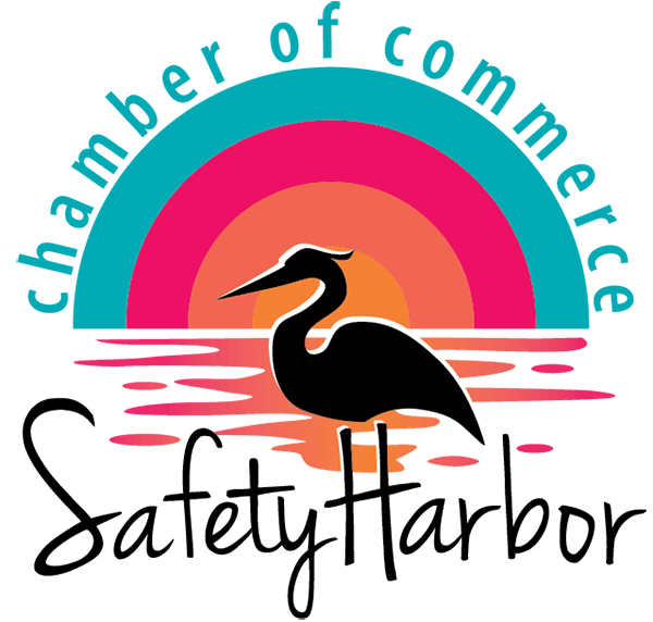 A silhouetted heron stands in water against a sunset background, representing St. Mark Village senior living, with "chamber of commerce" written in an arc above.